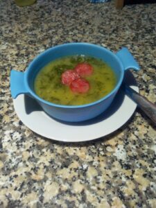 Traditional Portuguese caldo verde soup with chouriço