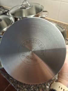 Bottom of the WMF Provence Plus pot with Transtherm technology engraved in stainless steel, compatible with all stovetops including induction, ceramic and gas.